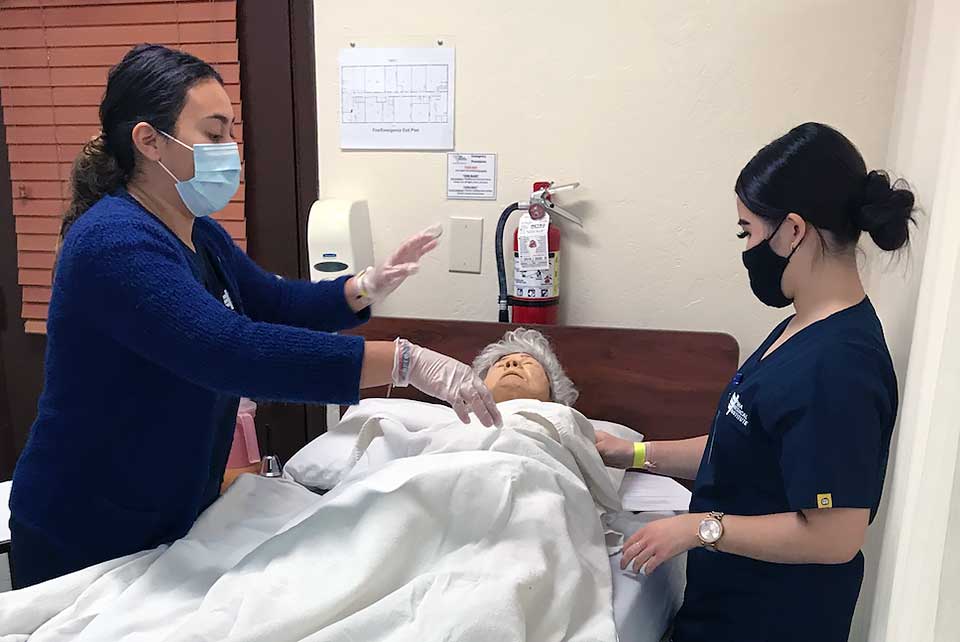 Nurse_Assistant_Students_working_on_simulation_patient