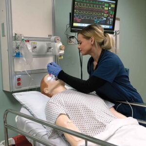 Practical_Nursing_Student_checking_eyes_on_simulation_patient_inset