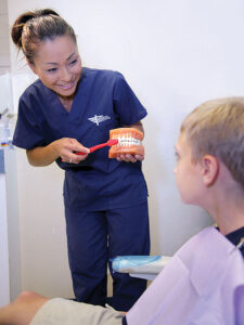 dental-assistant-with-patient