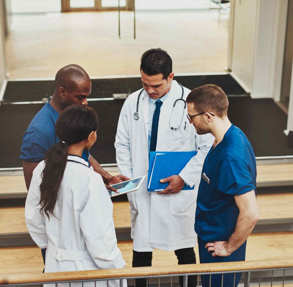photo of a medical team in an impromptu meeting