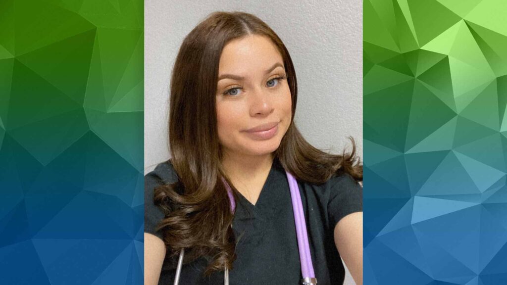 young woman in scrubs taking selfie in scrubs with stethoscope around her neck