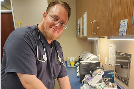 Photo of graduate Justin C