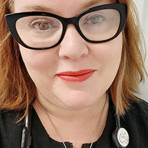 portrait of woman in scrubs