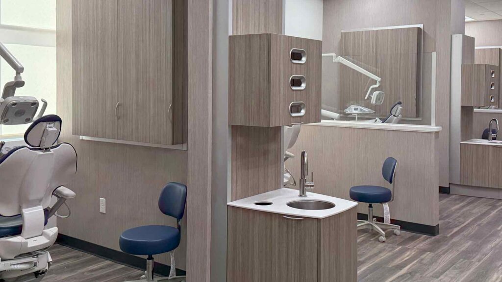 A look inside an empty dental hygiene lab with equipment/chairs in plain view